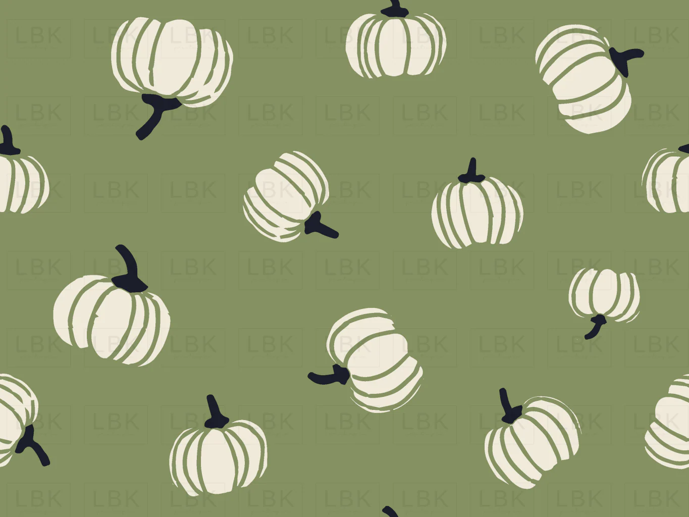 Tossed pumpkins on green